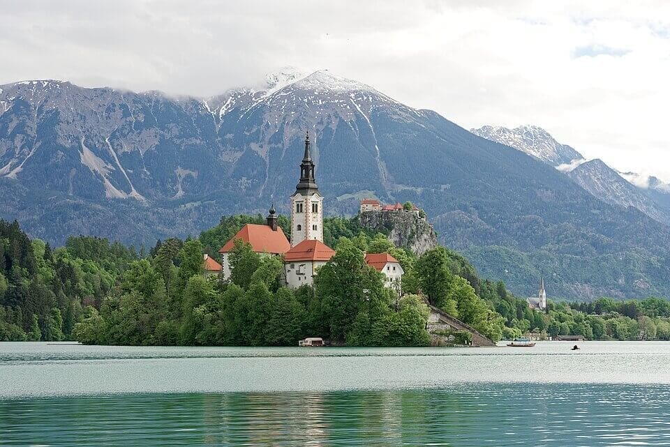 Lake Bled with island church and clifftop castle - Slovenia